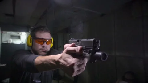 Front side angle of shooter in slow motion Stock Footage 61583924