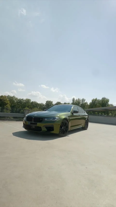 Front-Side Angle Shot of Green BMW Sedan – Speedramped (Editorial) Stock Footage 309455049