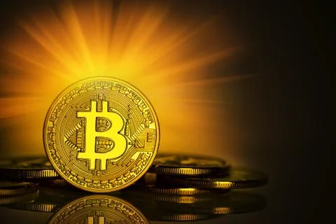The front side of the bitcoin glows brightly Stock Photos
