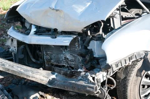 Front side of broken and damaged car wreck in crash accident Stock Photos