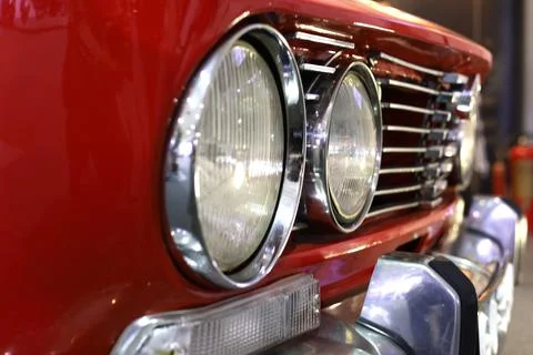 Front Side Head Lights An Bumper Of A Red Colored antique car Stock Photos