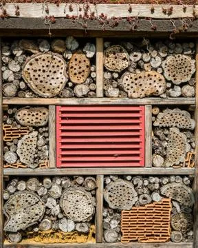 Front side of an insect hotel with various elements Stock Photos