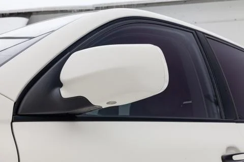 Front side mirror and window view of Porsche Cayenne 957 2007 in white color  Stock Photos