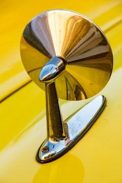 Front side mirror on Classic American yellow car Stock Photos