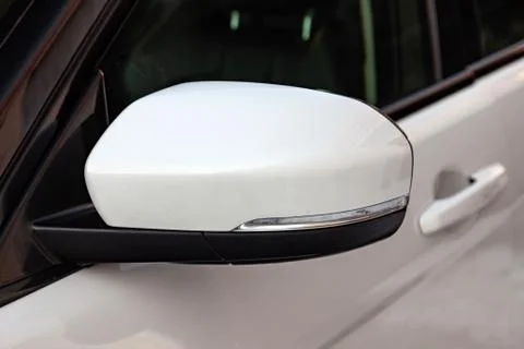 Front side mirror view of Range Rover Land Rover Evoque in white color after  Stock Photos