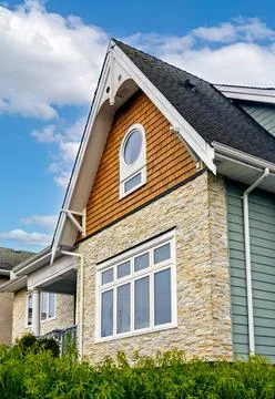 Front side of residential house on cloudy sky background in Canada Stock Photos