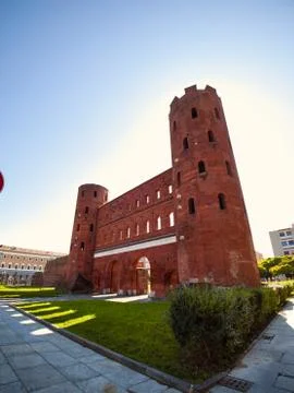 Front-side view of the palatine gate of Turin in a sunny morning Vertical 스톡 사진