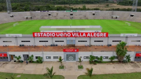 Front Sign Name Of Estadio Villa Alegre In Encarnación, Paraguay. Aerial Video stock 331123159
