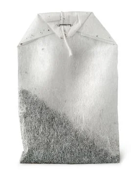 In front single tea bag with thread Stock Photos