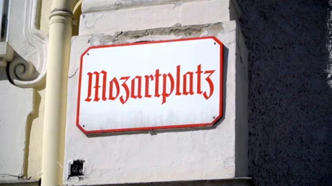 Front statuette where we can see the Scriptures that say that  Mozartplazt 스톡 동영상 162544036