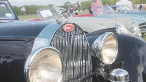 Front three-quarter view of a vintage Bugatti at a classic car rally d'Aumale Stock Footage 333914672