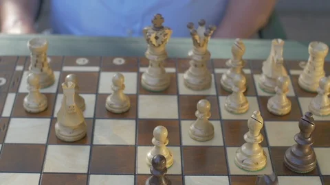 Front Top view of a chess game. Outside in garden Stock Footage 118712218