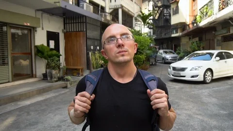 Front Tracking Shot Slowmo Caucasian Tourist Walking in Bangkok Old Town Stock Footage 102310029