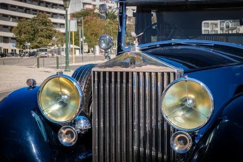 Front view of 1937 Rolls-Royce Phantom III in urban setting on sunny day Stock Photos
