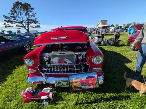 Front view of a 1955 Chevy 210 red family cruiser with open hood Stock Photos