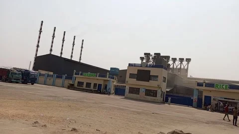 Front View Of African Rice Mill Industry With Trucks Kano Nigeria Stock Footage 328221822