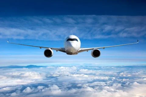 Front view of aircraft in flight. Stock Photos