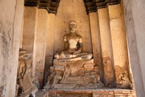 Front view of an ancient stone buddha statue of the ruined temple from Ayutth Stock Photos
