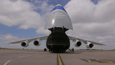 Front view of antonov heavy cargo airlift plane with gate open Stock Footage 248034010