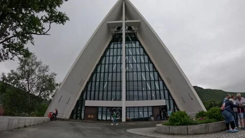 Front view of Arctic Cathedral architecture with tourists in Tromso Norway Stock-Footage 341272673