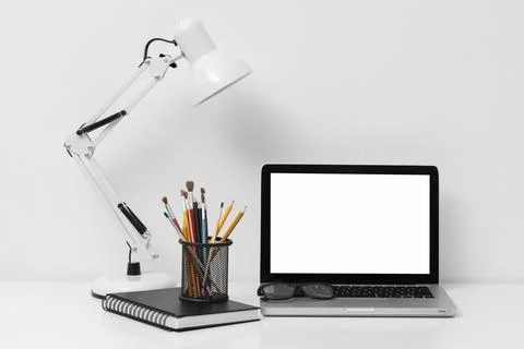 Front view arrangement office elements with laptop Stock Photos