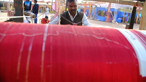 Front view of an artisan making a Patola saree, a traditional machine Stock Footage 243888891