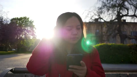 Front view of Asian black straight hair woman wearing coat sitting Stock Footage 170567386