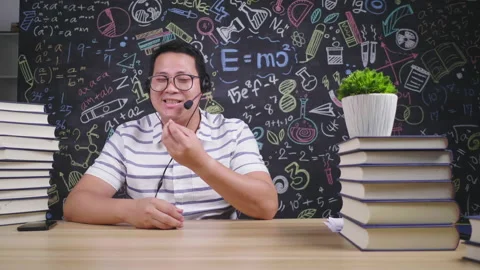 Front view of Asian man looking at camera and recording video Video stock 172058234