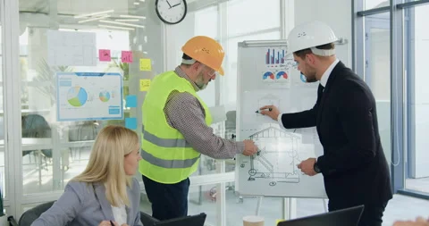 Front view of attractive confident purposeful experienced mixed races engineers Stock Footage 145810633