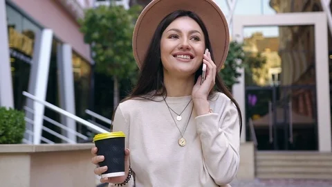 Front view of attractive elated young lady in lovely hat with her fresh coffee Stock Footage 120180018