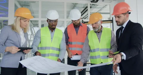 Front view of attractive serious skilled confident mixed races engineers or Stock Footage 145815729