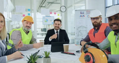 Front view of attractive smiling confident professional team of engineers and Stock Footage 145602890