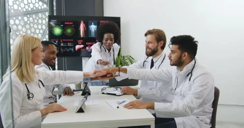 Front view of attractive smiling successful experienced diverse team of doctors Stock Footage 142878937