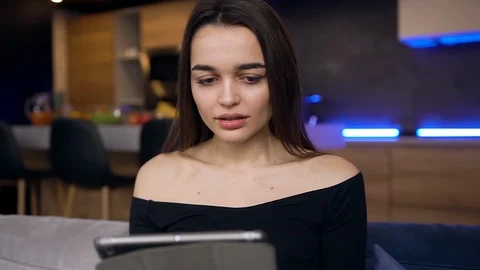 Front view of attractive surprised young modern girl which raised her hands from Stock Footage 127099135