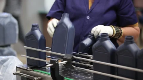 Front view of the automatic filling line conveyor when employee check every Stock Footage 301587857