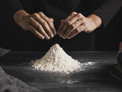 Front view baker hands mixing flour Stock Photos