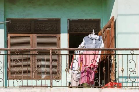 Front view of the balcony on which clothes are dried Stock Photos