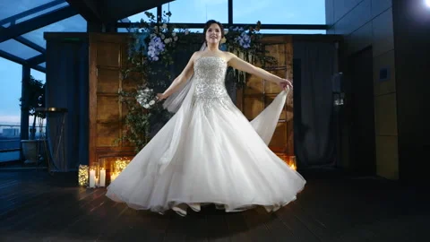 Front view of beautiful and charming european bride in elegant wedding dress and Stock Footage 131536833