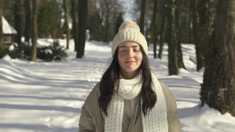 Front view. Beautiful and young girl walks and smiles in the winter forest Stock Footage 154209381
