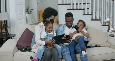 Front view of beautiful happy loving cheerful african american family which Stock Footage 144261442