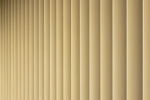 Front view of beige or golden 3d stripes. Louvre shutters like pattern. Stock Photos