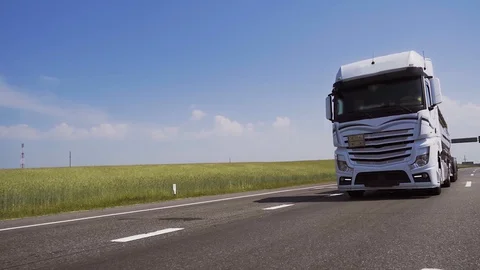 Front view from below of giant tank truck or fuel truck drive Stock Footage 128630974