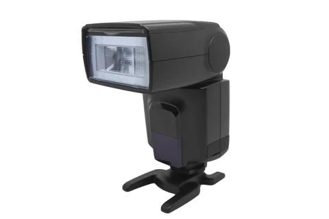 A front view of a black external camera flash speedlight mounted on a hot s.. 写真素材