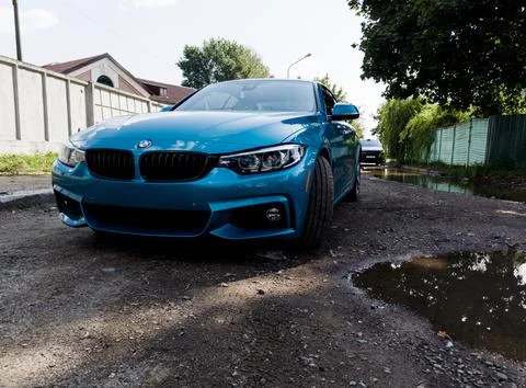 Front view of a blue BMW Stock Photos