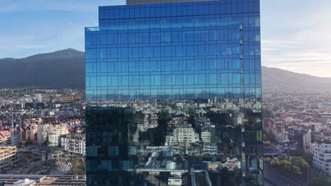 Front view of blue glass tower and city Video stock 347025533