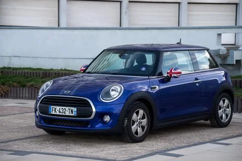 Front view of blue mini cooper parked in the street Stock Photos