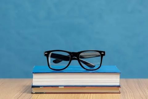 Front view books with glasses Stock Photos