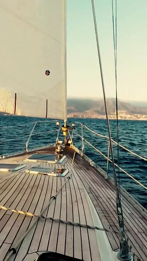 Front view from the bow of a sailboat navigating across the open ocean, with Video stock 344847492