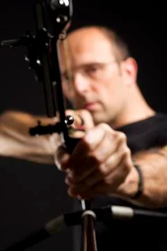 Front view of bowman with bow and arrow. Stock-Fotos