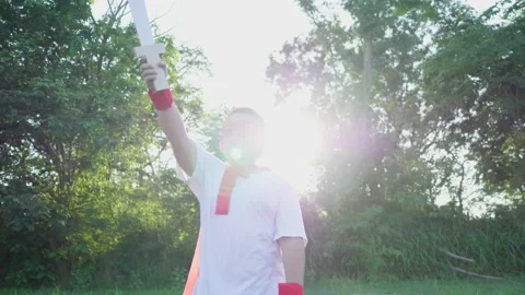 Front view of boy point sword up to the sky and walking come to camera Stock Footage 173353522